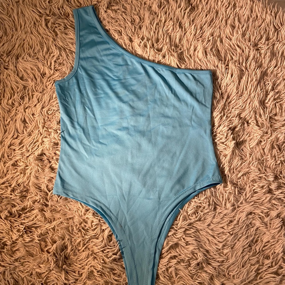 Bright blue one shoulder bodysuit